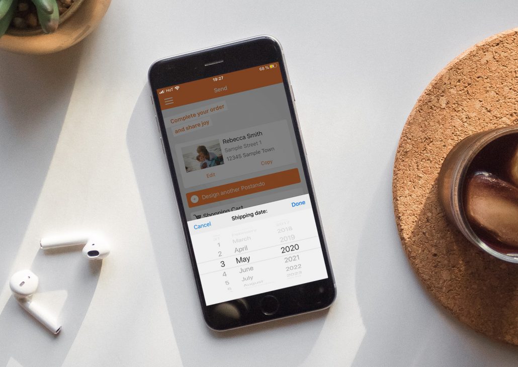 Mobile Phone with the Postando Postcard App open, selecting a shipping date
